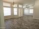 Expansive living room with wood-look tile flooring, recessed lighting, and lots of natural light at 1119 E Southshore Dr, Gilbert, AZ 85234