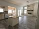 Open-concept living room with tile floors, granite counters, fireplace and stainless appliances at 1119 E Southshore Dr, Gilbert, AZ 85234