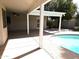 A view of the pool area with a covered patio featuring a ceiling fan and easy access to the pool at 1119 E Southshore Dr, Gilbert, AZ 85234