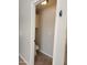 Compact powder room featuring a toilet and storage cabinet at 1119 E Southshore Dr, Gilbert, AZ 85234