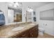 Bright bathroom featuring double sinks, granite countertops, and ample lighting at 11820 S Half Moon Dr, Phoenix, AZ 85044