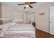 Cozy bedroom with wood floors, a full-sized bed, and a mirror door closet at 11820 S Half Moon Dr, Phoenix, AZ 85044