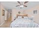 Inviting bedroom with a comfortable bed, ceiling fan, and neutral tones for a serene ambiance at 11820 S Half Moon Dr, Phoenix, AZ 85044