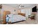 Comfortable bedroom featuring natural light, a ceiling fan, and a decorative bed set at 11820 S Half Moon Dr, Phoenix, AZ 85044