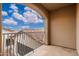 Balcony view with iron railing, red tile roof and blue sky at 12980 E Cochise Rd, Scottsdale, AZ 85259