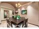 Elegant dining room featuring a wooden table with seating for six and stylish chandelier at 12980 E Cochise Rd, Scottsdale, AZ 85259