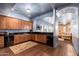 Living area with wood floors, blue walls, wood cabinets, and wet bar at 12980 E Cochise Rd, Scottsdale, AZ 85259