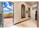 Home office featuring travertine floor, wood blinds and exterior access at 12980 E Cochise Rd, Scottsdale, AZ 85259