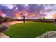 Backyard view features a half-court basketball court with synthetic grass at 12980 E Cochise Rd, Scottsdale, AZ 85259