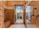 Elegant bathroom features a rainfall shower and access to a private outdoor courtyard with natural light at 14371 E Kalil Dr, Scottsdale, AZ 85259