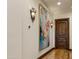 Hallway with hardwood flooring and custom lighting creates a warm ambiance at 14371 E Kalil Dr, Scottsdale, AZ 85259