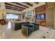 Bright living room with fireplace, entertainment cabinet and seating; featuring an opening to mountain views at 14371 E Kalil Dr, Scottsdale, AZ 85259