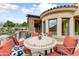 Inviting patio with comfortable seating and a stylish tile table, perfect for outdoor relaxation and entertaining at 14371 E Kalil Dr, Scottsdale, AZ 85259