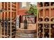 Custom wine rack showcasing various wine selections and decor in a sophisticated display at 14371 E Kalil Dr, Scottsdale, AZ 85259