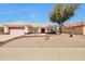 Single story home featuring desert landscaping, covered entry, and two car garage in a sunny locale at 14936 W Yosemite Dr, Sun City West, AZ 85375