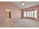 Vaulted main bedroom with bay window, plush carpeting and ensuite access at 14936 W Yosemite Dr, Sun City West, AZ 85375