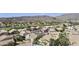 Expansive aerial view showcasing the neighborhood, golf course, and scenic mountain backdrop at 16008 S 13Th Way, Phoenix, AZ 85048