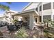 Covered back patio with brick pavers, ceiling fans, seating, and backyard views at 16008 S 13Th Way, Phoenix, AZ 85048