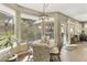 Bright eat-in kitchen features a bay window, a dining area, and views of the outdoor scenery at 16008 S 13Th Way, Phoenix, AZ 85048