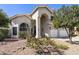 Charming stucco home featuring a well-maintained front yard, inviting curb appeal, and a two-car garage at 16008 S 13Th Way, Phoenix, AZ 85048