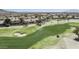 Aerial shot of the golf course featuring verdant greens and sand bunkers, surrounded by beautiful homes at 16008 S 13Th Way, Phoenix, AZ 85048