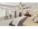 Bright main bedroom featuring large windows with shutters, providing natural light and privacy at 16008 S 13Th Way, Phoenix, AZ 85048