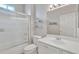 Bright bathroom features a glass enclosed shower and single sink vanity at 16014 W Kino Dr, Surprise, AZ 85374