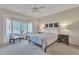 Serene bedroom featuring large windows, neutral tones, and cozy furnishings for ultimate relaxation at 16014 W Kino Dr, Surprise, AZ 85374