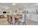 Dining area adjacent to the kitchen features tiled floors, and stylish decor under a bright ceiling fan at 16014 W Kino Dr, Surprise, AZ 85374