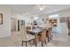 Bright dining area with tiled floors, a ceiling fan, and open access to the kitchen at 16014 W Kino Dr, Surprise, AZ 85374