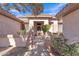 Welcoming front entrance with a security gate and desert landscaping under a sunny sky at 16014 W Kino Dr, Surprise, AZ 85374