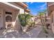 Charming front entrance with well-maintained desert landscaping, a tiled roof, and a sunny sky at 16014 W Kino Dr, Surprise, AZ 85374