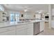 Open kitchen showcasing a sink, stainless steel appliances, and seamless transition to the living space at 16014 W Kino Dr, Surprise, AZ 85374