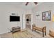 Relaxing living room featuring neutral walls, a comfy bench and a wall mounted TV at 16014 W Kino Dr, Surprise, AZ 85374