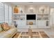 Living room showcasing built-in shelving, tiled floors, plantation shutters, and neutral decor at 16014 W Kino Dr, Surprise, AZ 85374