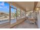 Inviting screened-in patio, perfect for outdoor dining and relaxation with views of the landscaped yard at 16014 W Kino Dr, Surprise, AZ 85374