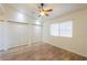 Bedroom featuring wood floors, a ceiling fan and closet space at 1668 E Valerie St, Casa Grande, AZ 85122