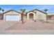 Charming single-story home featuring a two-car garage, desert landscaping, and a welcoming front entrance at 1668 E Valerie St, Casa Grande, AZ 85122