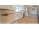 Kitchen featuring stainless steel appliances, white cabinets, granite counter tops, and wood flooring at 1668 E Valerie St, Casa Grande, AZ 85122