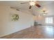 Spacious living room featuring wood-look flooring, high ceilings, and neutral walls at 1668 E Valerie St, Casa Grande, AZ 85122