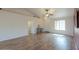 Inviting living room showcasing wood-look floors and ample natural light from a large window at 1668 E Valerie St, Casa Grande, AZ 85122