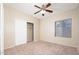 Bedroom with a closet and bright natural light at 17768 W Maui Ln, Surprise, AZ 85388