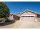 Charming single-story home with a well-maintained yard, desert landscaping, and a two-car garage at 17768 W Maui Ln, Surprise, AZ 85388