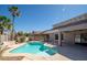 Inviting pool surrounded by lush landscaping and a pergola-covered patio area at 17768 W Maui Ln, Surprise, AZ 85388