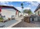 Outdoor space with a built-in grill, bar seating and decorative fireplace, perfect for outdoor entertaining at 17801 N 43Rd Way, Phoenix, AZ 85032