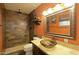 Stylish bathroom boasts a unique glass bowl sink and tiled walk-in shower at 17801 N 43Rd Way, Phoenix, AZ 85032