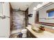Beautiful bathroom with tile shower, large glass sink bowl, and decorative mirror at 17801 N 43Rd Way, Phoenix, AZ 85032