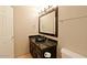 Modern bathroom features dark wood vanity and updated fixtures at 17801 N 43Rd Way, Phoenix, AZ 85032