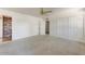 Bedroom with carpet floors, ceiling fan, closet, neutral paint, and doorway that leads to a connecting room at 17801 N 43Rd Way, Phoenix, AZ 85032