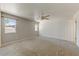 Bedroom with carpet floors, ceiling fan, neutral paint, natural light, and two windows at 17801 N 43Rd Way, Phoenix, AZ 85032